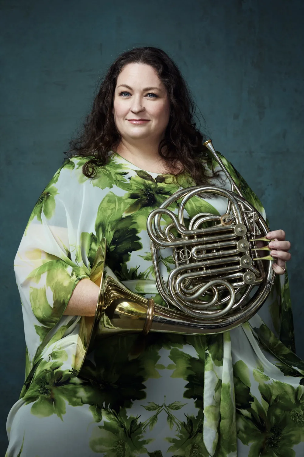 Close portrait of Megan Cullen against a green backdrop